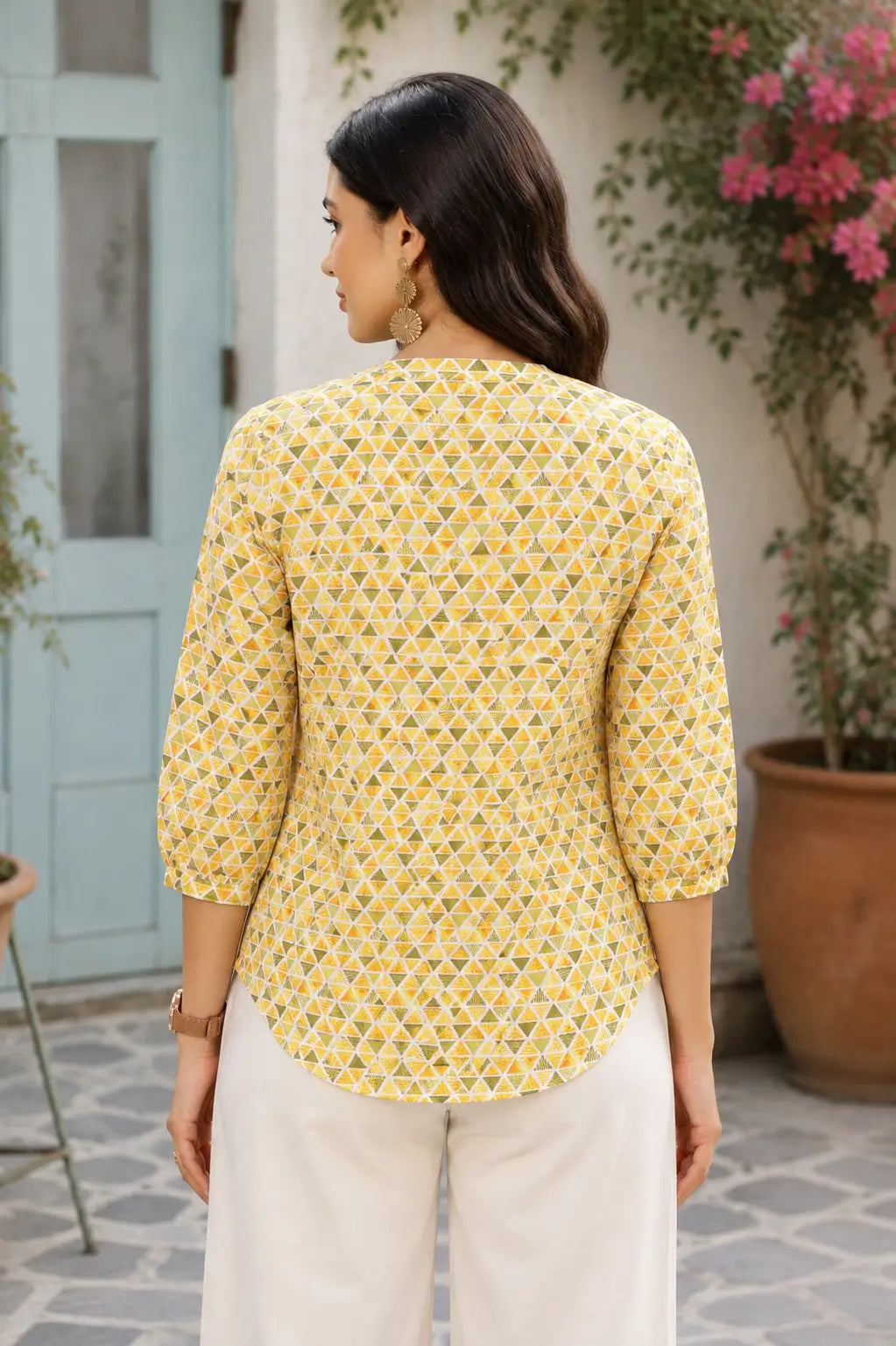 Back view of yellow cotton geometric printed women short top with curved hem and 3-4 elastic sleeves by Rabric
