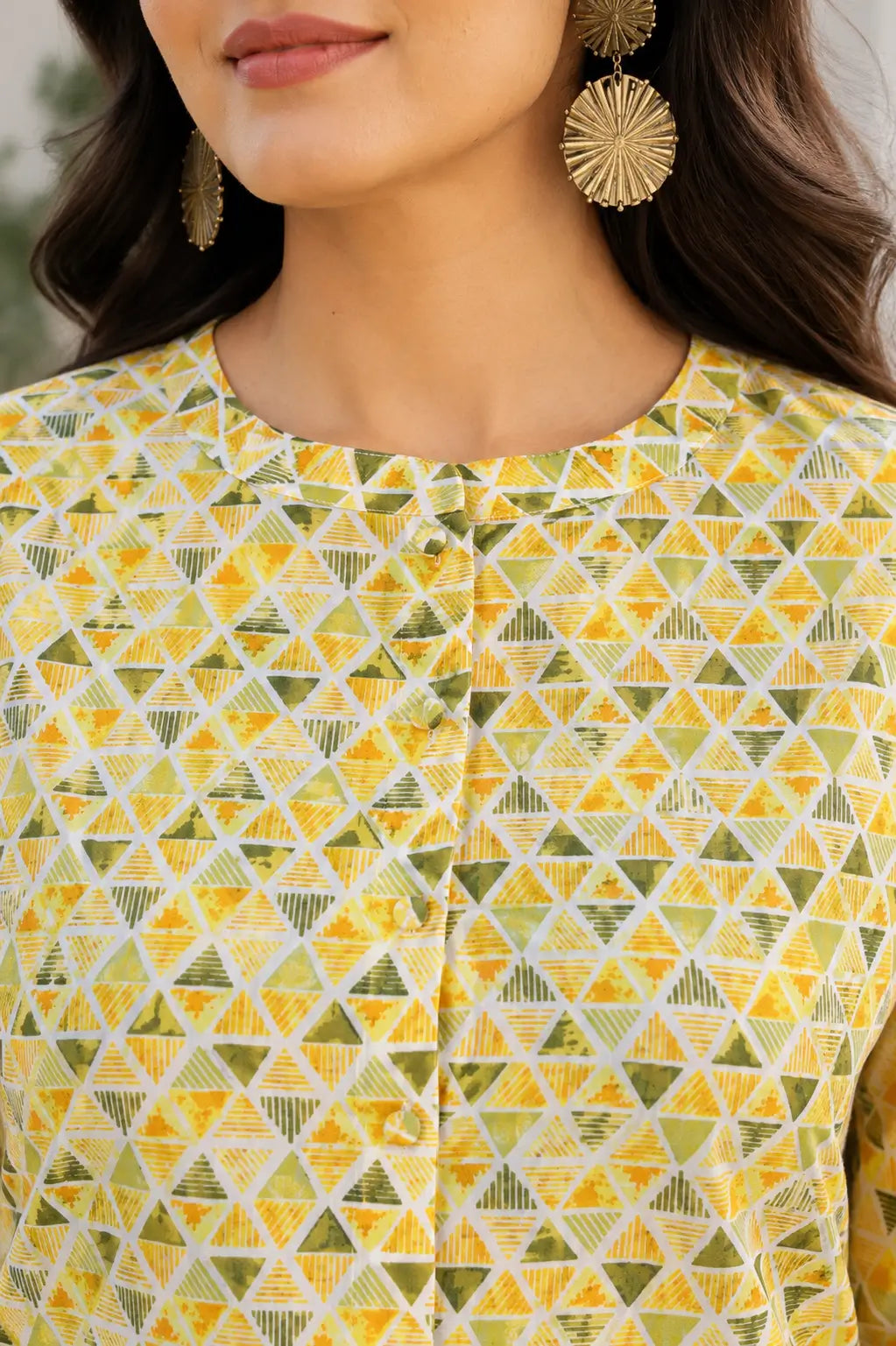 Closeup neck design of yellow cotton geometric printed women short top with front button placket by Rabric