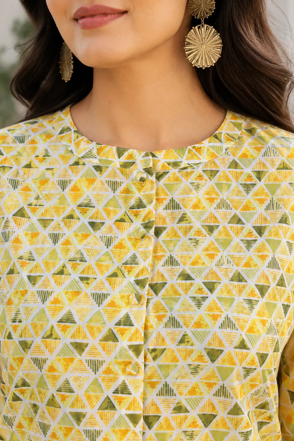 Closeup neck design of yellow cotton geometric printed women short top with front button placket by Rabric