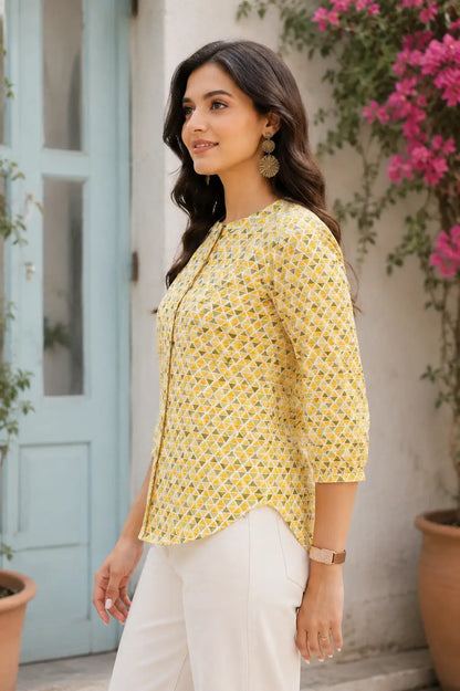 Side angle of yellow cotton geometric print shirt style short top for women with relaxed casual fit by Rabric