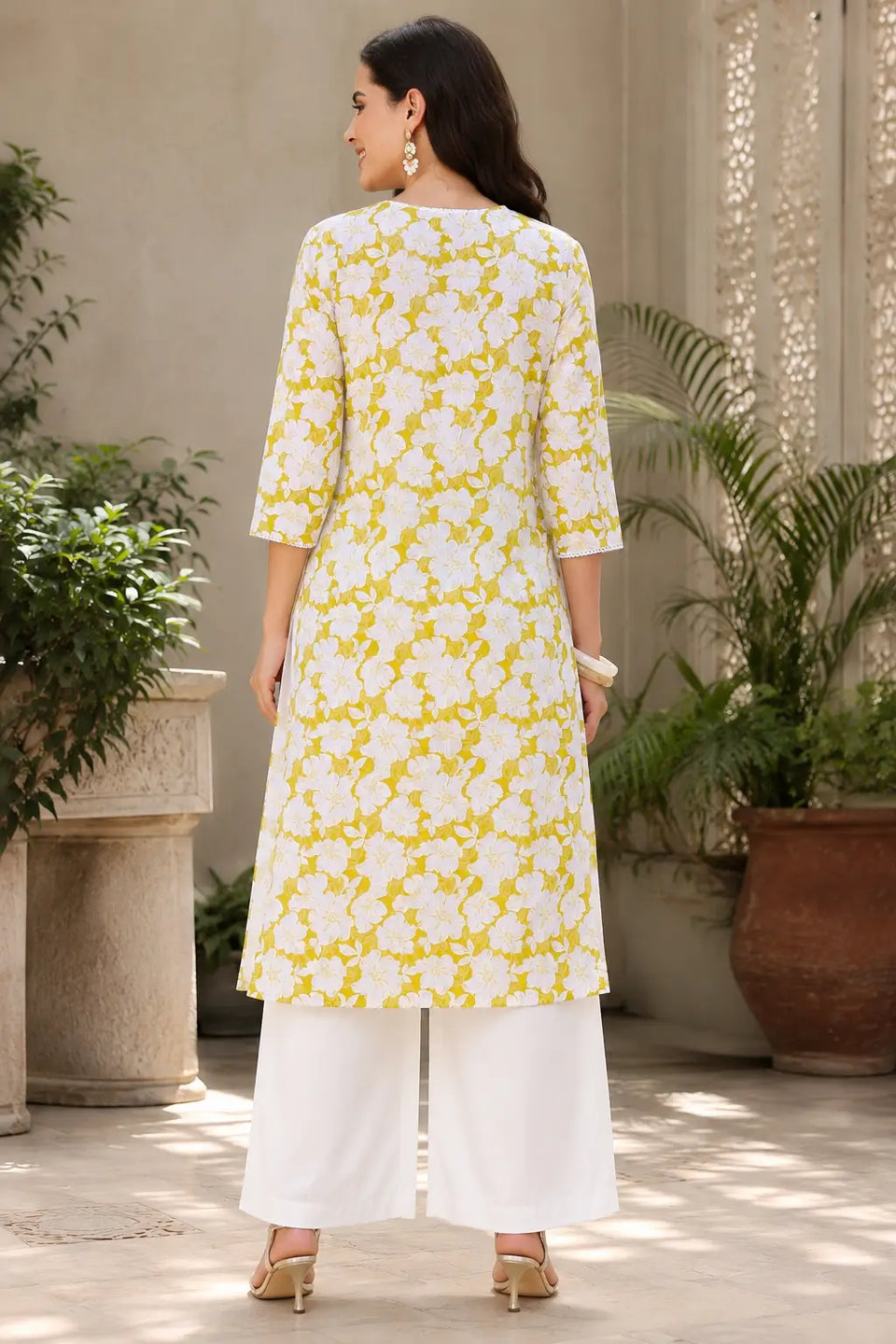 Back view of Rabric yellow white floral cotton kurti for women with straight fit design and 3/4 sleeves