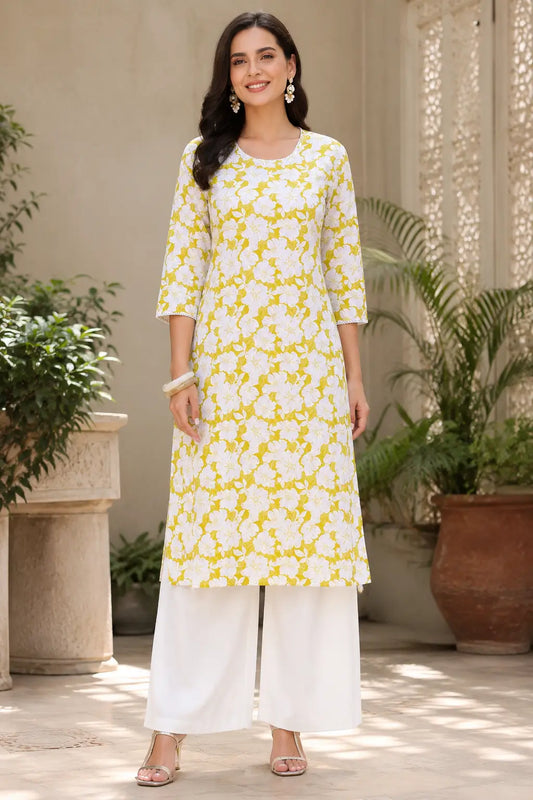 Rabric women yellow and white floral cotton kurti front view with 3/4 sleeves and stylish round neck design paired with white palazzo